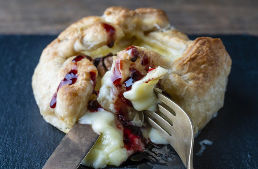 MouCo Camembert cheese baked in puff pastry topped with red berry jam