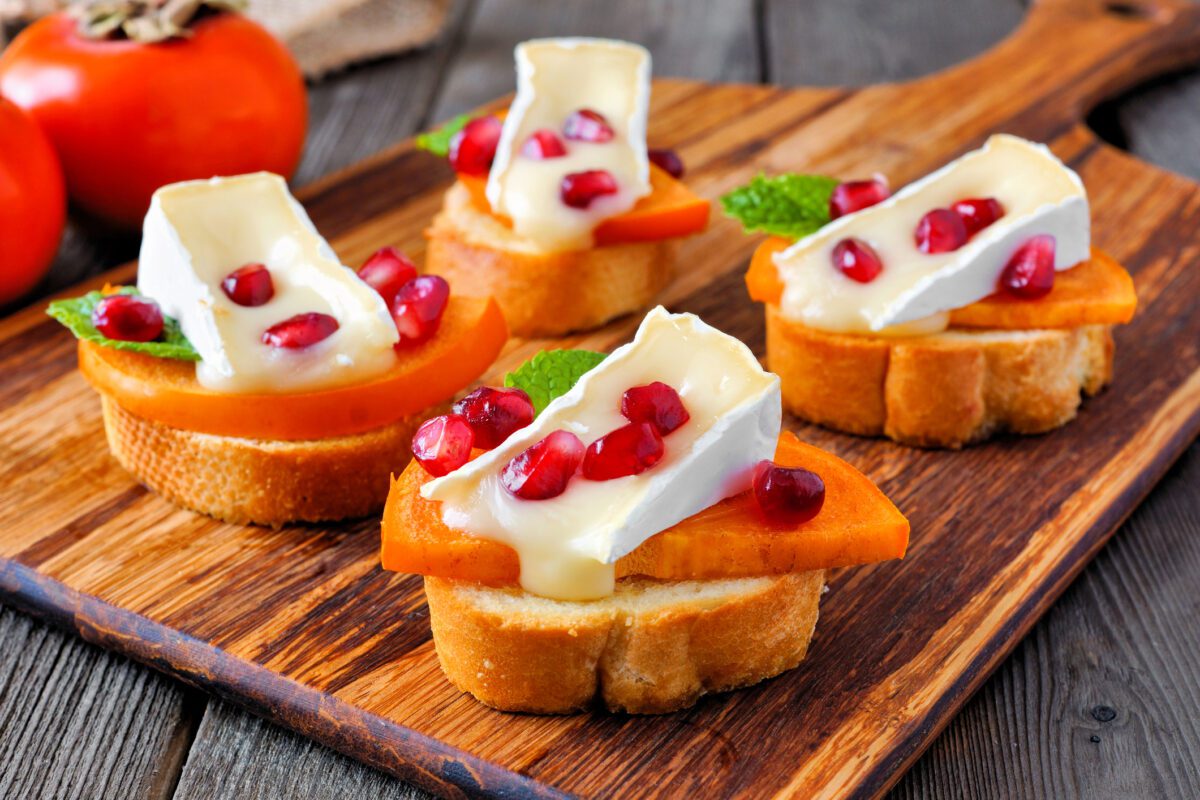 Crostini appetizers with persimmons, pomegranates…